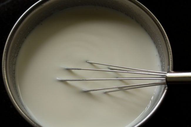 With a wired whisk, whip the curd till smooth.