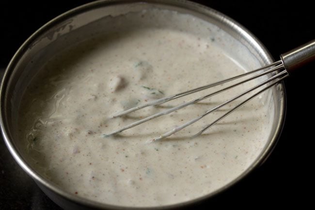 mixing spices with curd