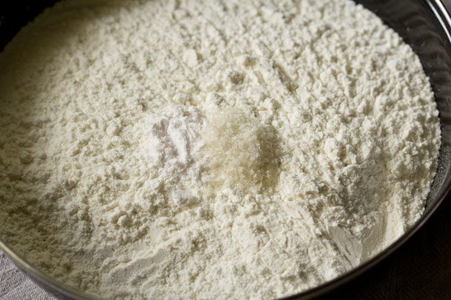 flour and salt for no yeast pizza dough in a bowl