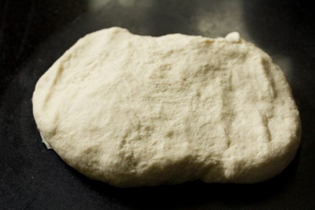 kneading pizza dough