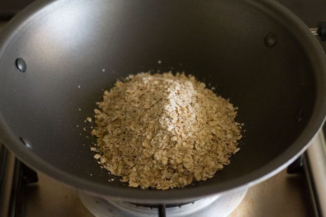 oats added to hot ghee in pan. 
