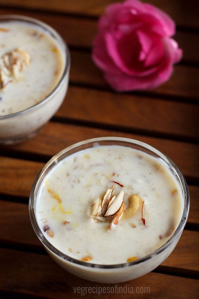 oats kheer garnished with chopped almonds and served in a glass bowl. 