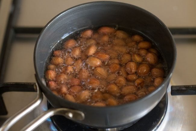 peanuts being fried in oil