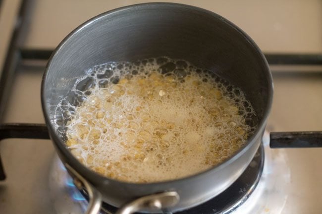 chana dal being fried in oil