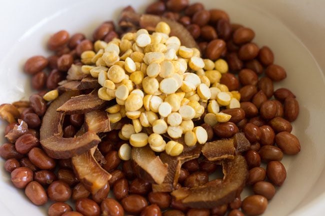 fried chana dal on bowl with the fried peanuts and coconut slices
