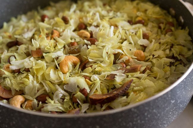 poha ingredients mixed in pan