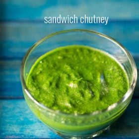 sandwich chutney in a glass bowl on a blue tray.