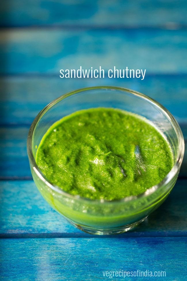 sandwich chutney in a glass bowl on a blue tray.