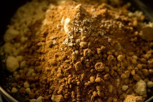 cardamom powder added to the roasted sattu flour-jaggery mixture. 