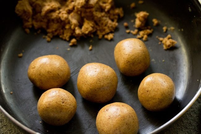 sattu laddu shaped from the prepared mixture. 