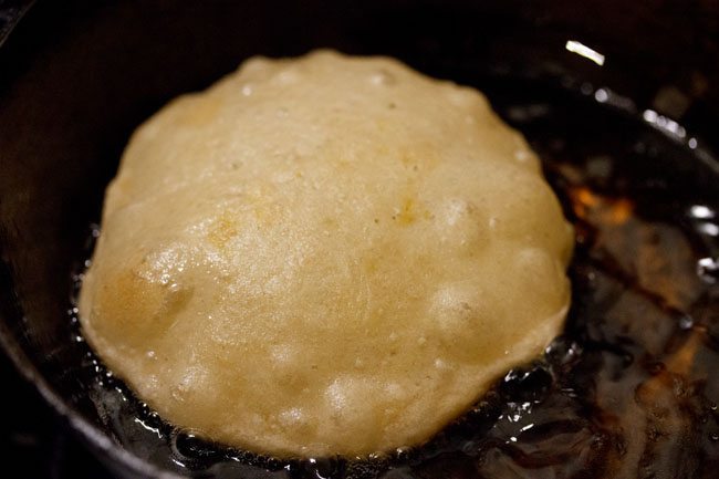 kachori turned over and frying. 