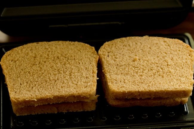 pizza sandwich placed in a preheated sandwich maker