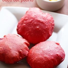 beetroot poori served on a white plate with a side of potato curry.