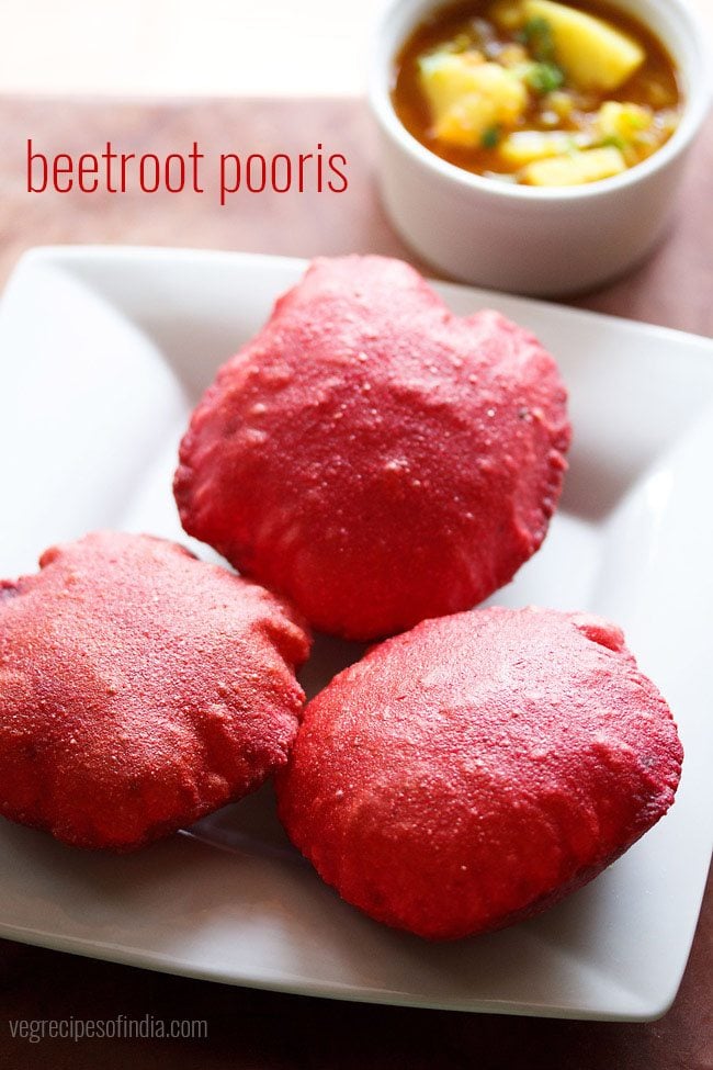 beetroot poori served on a white plate with a side of potato curry.