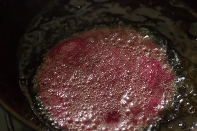 frying beetroot poori in oil