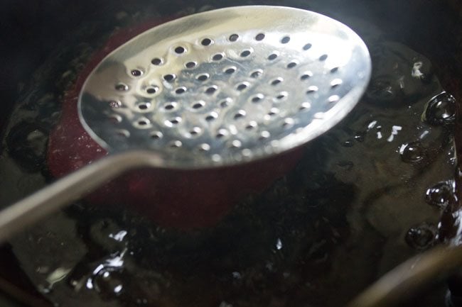 frying beetroot poori - preparing beetroot poori recipe
