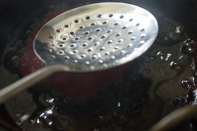 frying beetroot poori 