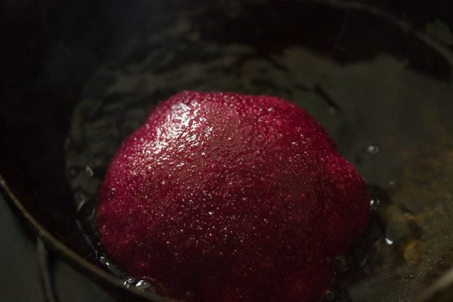 frying beetroot poori in oil