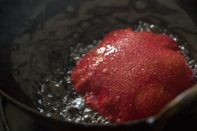 frying beetroot poori