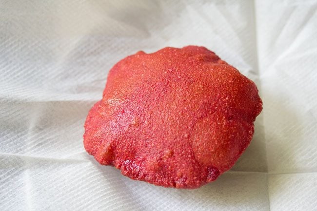 fried beetroot poori on kitchen paper towels