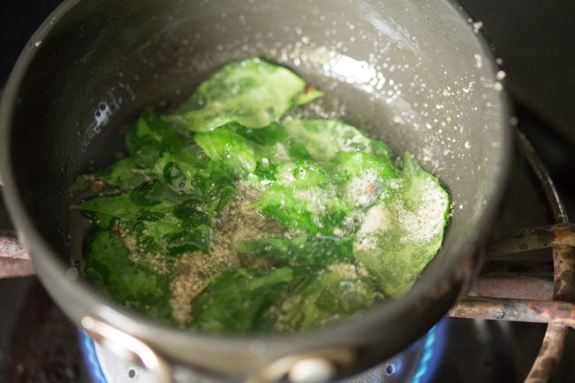 curry leaves and asafoetida added to the oil. 