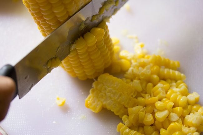 removing kernels with a knife.