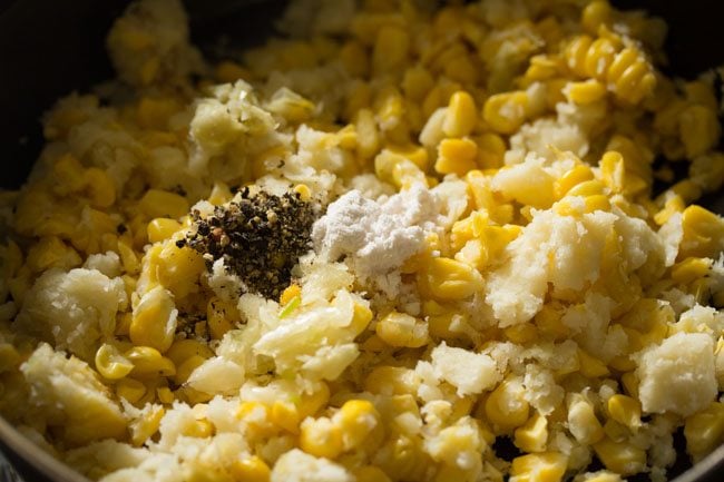 seasonings added to corn potato mixture in bowl.