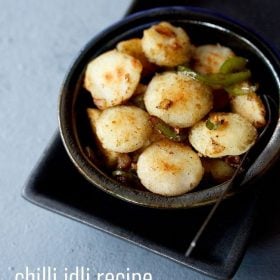 chilli idli served in a ceramic bowl with a spoon in it and text layovers.