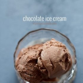 top shot of chocolate ice cream in glass bowl on grey table with text layovers
