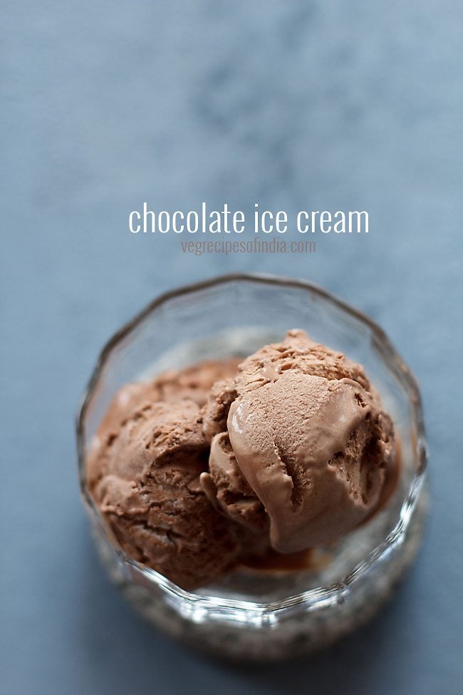 top shot of chocolate ice cream in glass bowl on grey table with text layovers