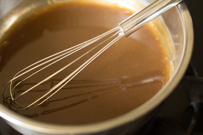 stirring the milk-sugar mixture on heat