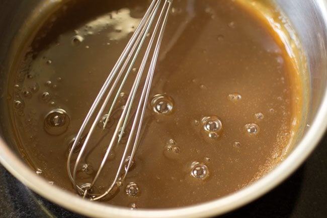 dissolving the sugar in the milk 