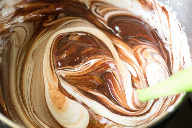 gently folding the chocolate mixture with the whipped cream 