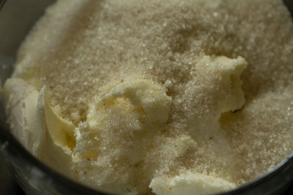 cream cheese and sugar in a mixing bowl