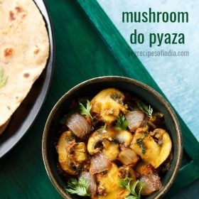 mushroom do pyaza garnished with cilantro sprigs in a dark olive green ceramic bowl on a dark green board with a side of roti with text layovers.