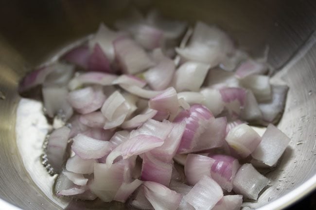 cubes onions in a skillet