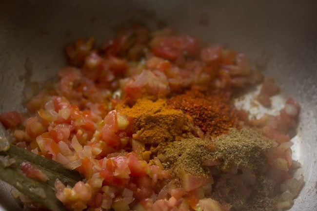 ground spices on the chopped tomatoes