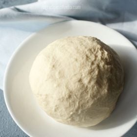 no yeast pizza dough in a white plate on a light blue napkin