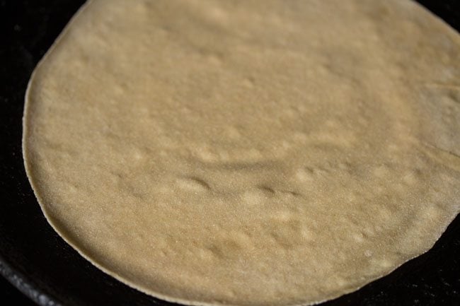 cook the roti base till 1/4th