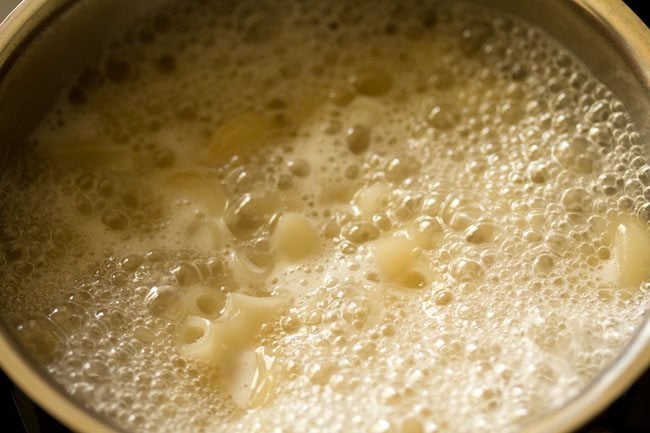 cooking pasta in boiling water. 