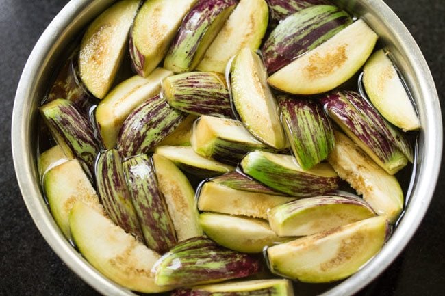 brinjal wedges soaking in salted water. 