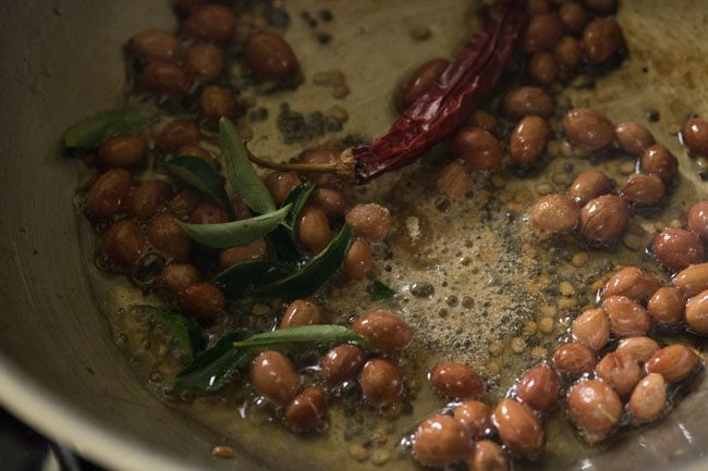 dried red chilies, curry leaves and asafoetida added to hot oil. 