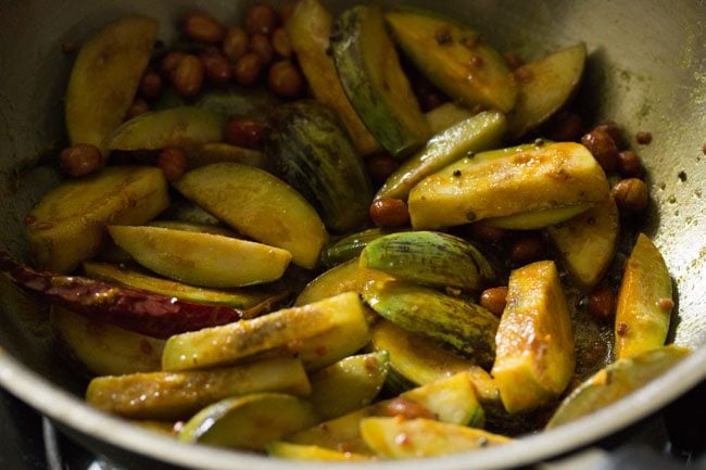 turmeric powder and salt mixed with the brinjals. 