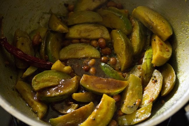 tamarind pulp added to the brinjals. 