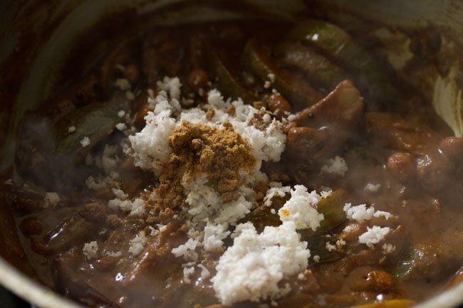 grated fresh coconut and jaggery powder added to the brinjals. 