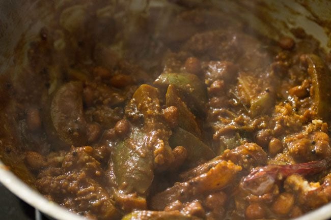 cooking brinjal masala in the pan. 