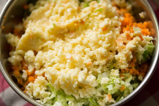 mayo and grated cheese on grated veggies
