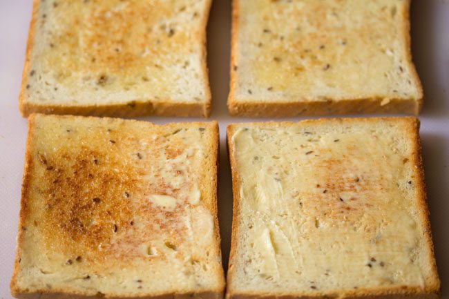 toasted bread slices with butter spread on them