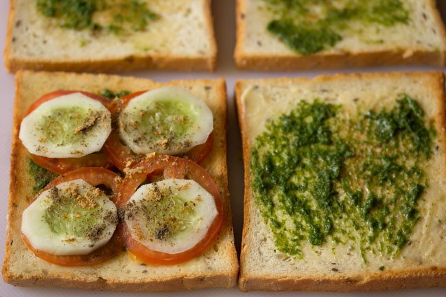 cucumbers, tomatoes, black pepper, chaat masala powder and salt on toast