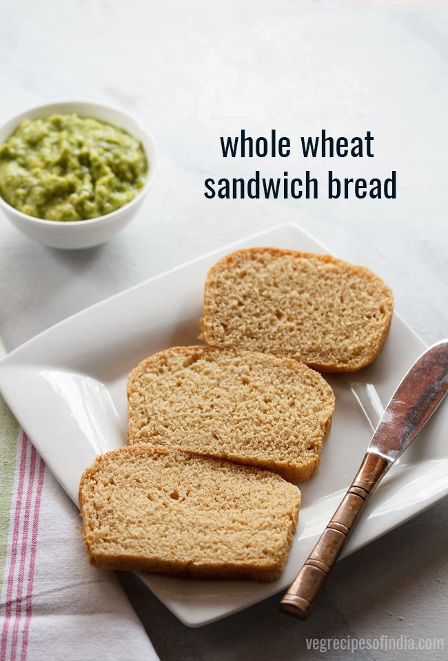 whole wheat sandwich bread sliced and served on a white plate with a butter knife kept on the right side, a bowl of guacamole kept on the top left side and text layover. 